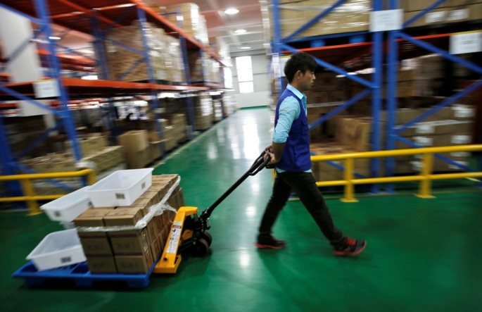 An employee works at an Alibaba warehouse on the outskirts of Hangzhou, Zhejiang Province. China’s cabinet recently rolled out several policies to benefit the nation’s e-commerce sector.