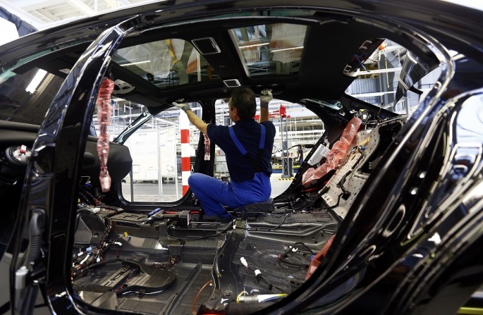 A worker assembles a Mercedes-Benz S-class model.