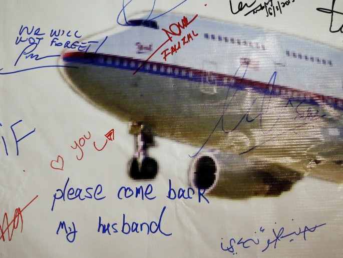 A message left on a board of remembrance by Kelly (last name not given), 29, the wife of a passenger aboard missing Malaysia Airlines Flight MH370, at a vigil ahead of the one-year anniversary of its disappearance in Kuala Lumpur, March 6, 2015. Malaysia 