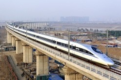 A high-speed train traveling to Guangzhou as seen running on Yongdinghe Bridge in Beijing. 