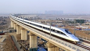 A high-speed train traveling to Guangzhou as seen running on Yongdinghe Bridge in Beijing. 