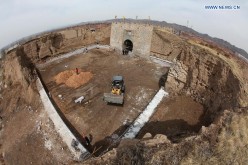 Workers restore the southern barbican entrance to Wanquan Castle in Wanquan County, north China's Hebei province, April 6, 2015. Wanquan Castle, which was built in 1393, is a well-preserved military castle of the Ming Dynasty (1368-1644).