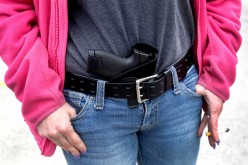 Gloria Lincoln-Thompson carries pistol in her waist band during a rally in support of the Michigan Open Carry gun law in Romulus, Michigan April 27, 2014