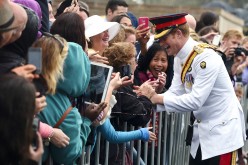 Britain's Prince Harry shakes hands with members of the public after visiting the Australian War Memorial in Canberra April 6, 2015.