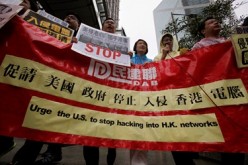 Protesters from Democratic Alliance for the Betterment of Hong Kong (DAB) march to the U.S. Consulate in Hong Kong to protest the United States government hacking into Hong Kong computers.