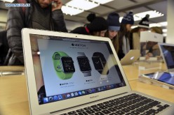 A screen displays the three designs of Apple's new wearable gadget.