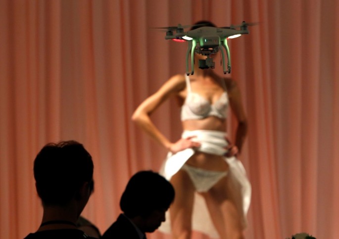 A drone takes a video of a model during a rehearsal for the 2014 China Fashion Week in Beijing. 