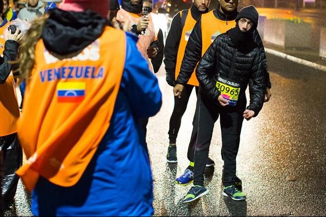 Maickel Melamed (in black) finishes the 2015 Boston Marathon despite his illness