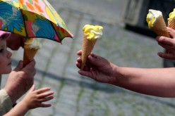 A young girl waits for an ice cream at the main square in the town of Klatovy.