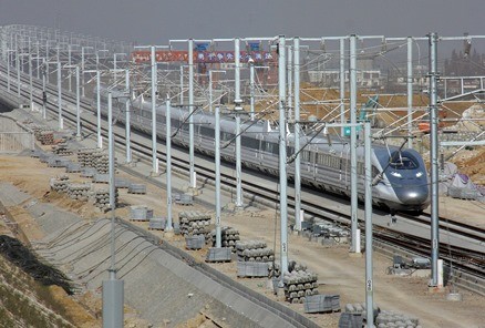 A high speed train travels during a test operation in Bengbu, Anhui Province in Dec. 2010. The train CRH380A hit a speed of 486km/hr and broke the world record for unmodified commercial use.
