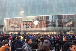 Customers gather and wait for the opening of an Apple store in Shenyang, Liaoning Province in Feb. 2015.