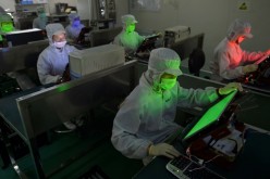 Employees work inside an LCD factory in Wuhan, Hubei Province.