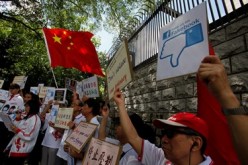Chinese demonstrators protest in 2013 outside the U.S. Consulate in Hong Kong over claims from Edward Snowden that the National Security Agency (NSA) hacked computers in the Chinese territory.