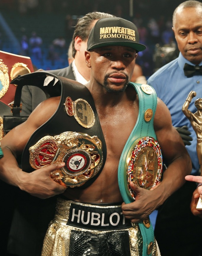 Floyd Mayweather, Jr. of the U.S. poses with his title belts after defeating Manny Pacquiao of the Philippines in their welterweight WBO, WBC and WBA (Super) title fight in Las Vegas, Nevada, May 2, 2015.    