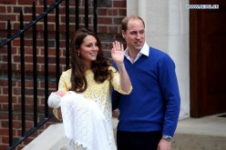 The newborn baby girl makes her first appearance to the public with the Duke of Cambridge and the Duchess outside St. Mary's Hospital in London, on May 2, 2015. 