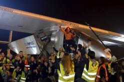 Swiss pilot Bertrand Piccard waves from the cockpit of Solar Impulse 2 after the plane landed at Nanjing Lukou International Airport, Jiangsu Province, April 22, 2015.