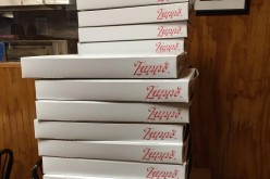 stack of pizza boxes 