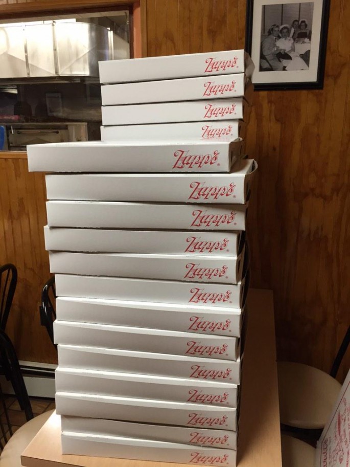 stack of pizza boxes 
