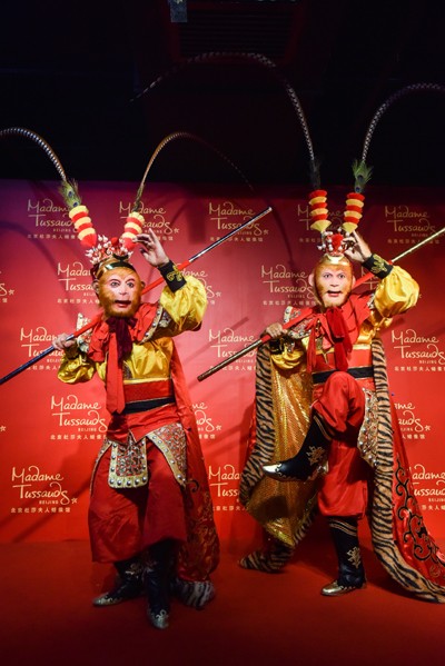 Who is the real Monkey King? Chinese actor Zhang Jinlai making a pose with his wax duplicate in an exhibit at Madame Tussauds Beijing.