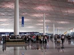 Passengers queue at Terminal 3 of Beijing Capital International Airport.