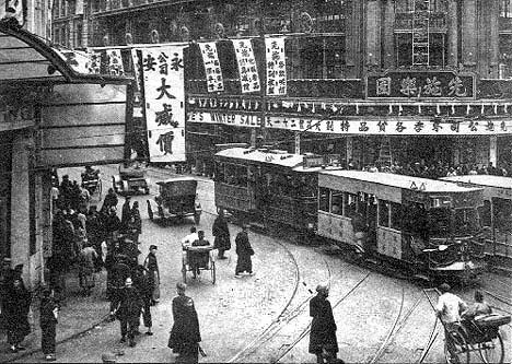 An old-style tram shuttles citizens about their day in 1920s Shanghai.