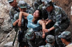 Rescuers save an injured woman after an earthquake hit Baosheng Township in Lushan County, Ya'an City, in southwest China's Sichuan Province.