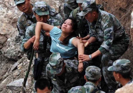 Rescuers save an injured woman after an earthquake hit Baosheng Township in Lushan County, Ya'an City, in southwest China's Sichuan Province.