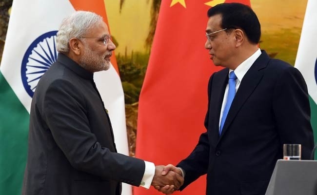 Indian Prime Minister Narendra Modi shakes hands with Chinese Premier Li Keqiang after a joint press conference in the Great Hall of the People in Beijing.