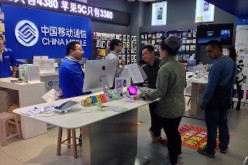 Various types of mobile phones are being sold in China Mobile’s store at the Link City shopping mall in Shenzhen.