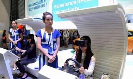 Visitors try one of the featured products at the 2015 International Consumer Electronics Show (CES) Asia in Shanghai.
