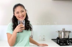 A Woman Drinking Glass of Water