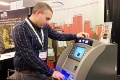 A developer of China's first ATM with facial recognition feature tests the machine in public.