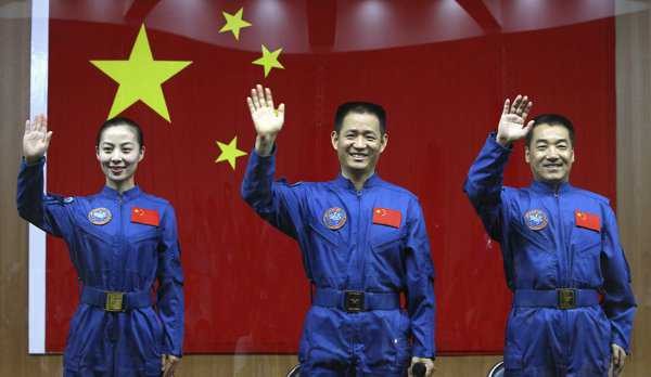 Shenzhou-10 crew (from left) Wang Yaping, Nie Haisheng and Zhang Xiaoguang during their arrival at Tiangong-1 Space Station.