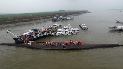 Rescue workers search for a sunken ship at the Jianli section of the Yangtze River in Hubei Province, China, on June 2.