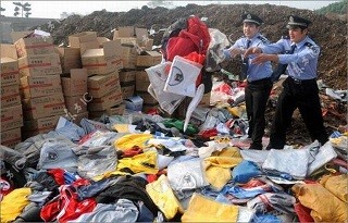 Chinese authorities prepare to destroy fake goods confiscated by police.