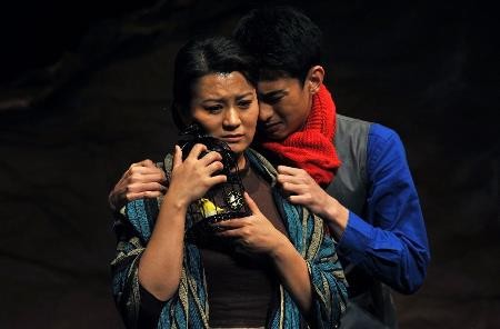 Actors rehearse for the stage drama "Gunshot" shown in Beijing in April 2014.