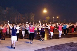 Dancing in public plaza is a common sight in many Chinese cities. 