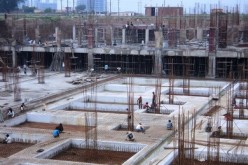 Workers lay out the foundation for a building being constructed in China.