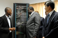 Ghana officials look over an equipment for ICT given by Huawei for its ICT laboratory.