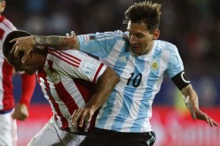 Argentina's Lionel Messi got entangled with Paraguay's Paulo Da Silva during their Copa America 2015 opener.