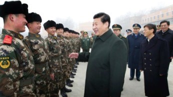 President Xi Jinping talks to some members of the People's Liberation Army after reviewing the troops.