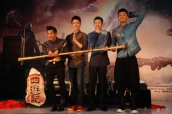 “Monkey King 2” cast members Aaron Kwok (left) and Feng Shaofeng (second from left) pose for the press during a press conference.