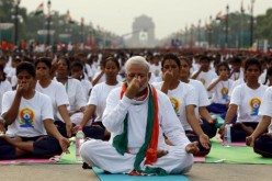 Prime Minister Narendra Modi and Indian youth doing yoga.