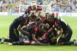 Germany's players celebrate a goal by Dzsenifer Marozsán