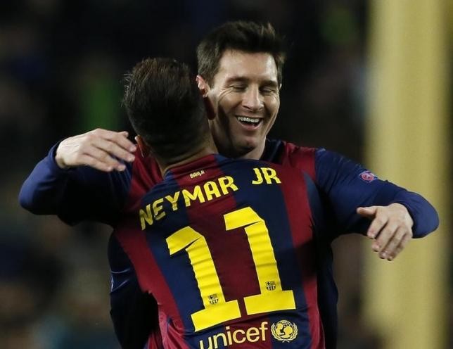 Barcelona star Lionel Messi of Argentina embraces teammate Neymar of Brazil