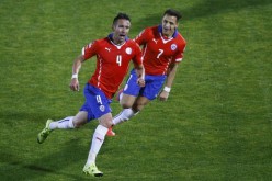 Chile's Mauricio Isla (#4) with teammate Alexis Sanchez (#7)