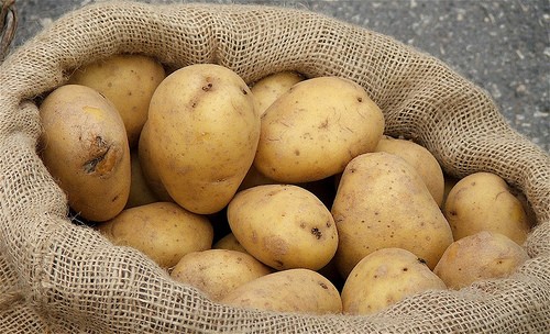 A sack of cleaned potatoes