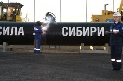 Welders join the first link in the Power of Siberia main gas pipeline in a ceremony attended by Russian President Vladimir Putin, held at Namsky Highway near Us Khatyn village.
