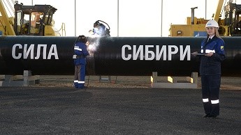 Welders join the first link in the Power of Siberia main gas pipeline in a ceremony attended by Russian President Vladimir Putin, held at Namsky Highway near Us Khatyn village.