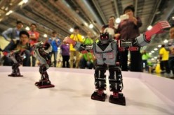 A team of Chinese students tests the robots they made as they prepare for a major robot competition in the U.S.